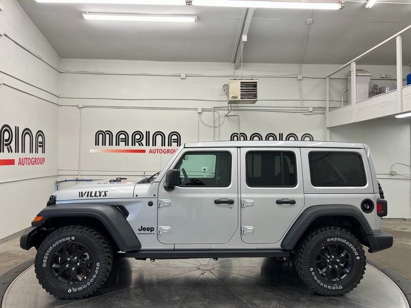 2023 Jeep Wrangler 4-door Willys 4x4 in a Silver Zynith Clear Coat exterior color and Blackinterior. Marina Auto Group (855) 564-8688 marinaautogroup.com 