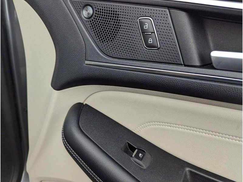 2022 Ford Edge Titanium in a Carbonized Gray Metallic exterior color and Medium Soft Ceramicinterior. Johnson Dodge 601-693-6343 pixelmotiondemo.com 