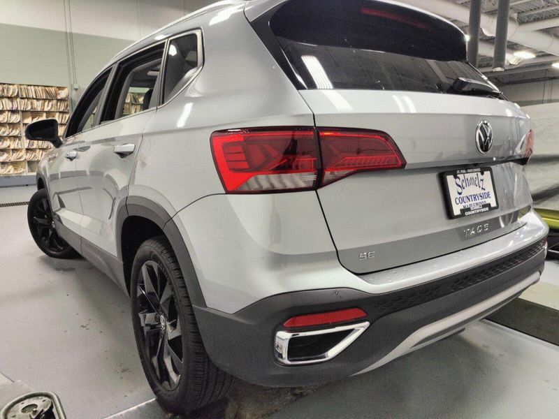 2023 Volkswagen Taos SE w/Sunroof/Black Wheel Pkg in a Pyrite Silver Metallic exterior color and Black Heated Seatsinterior. Schmelz Countryside Alfa Romeo (651) 867-3222 schmelzalfaromeo.com 