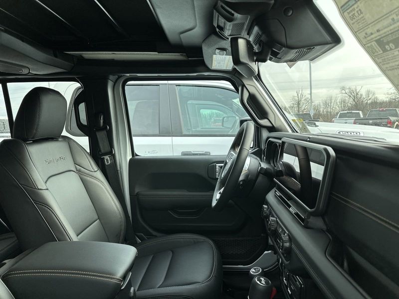 2024 Jeep Wrangler 4-door Sahara in a Silver Zynith Clear Coat exterior color and Blackinterior. Gupton Motors Inc 615-384-2886 guptonmotors.com 