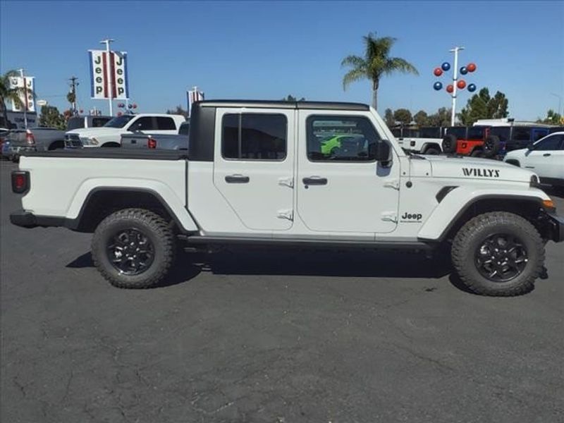 2023 Jeep Gladiator Sport in a Bright White Clear Coat exterior color and Blackinterior. Perris Valley Auto Center 951-657-6100 perrisvalleyautocenter.com 