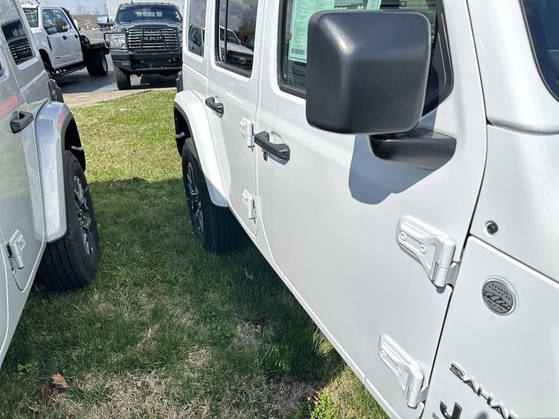 2024 Jeep Wrangler 4-door Sahara in a Bright White Clear Coat exterior color. Gupton Motors Inc 615-384-2886 guptonmotors.com 