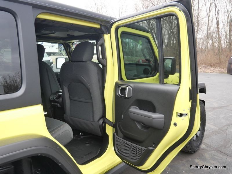 2024 Jeep Wrangler 4-door Willys in a High Velocity Clear Coat exterior color and Blackinterior. Paul Sherry Chrysler Dodge Jeep RAM (937) 749-7061 sherrychrysler.net 