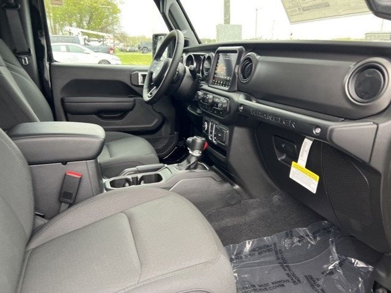 2023 Jeep Wrangler 2-door Sport S 4x4 in a Black Clear Coat exterior color and Blackinterior. Lakeshore CDJR Seaford 302-213-6058 lakeshorecdjr.com 