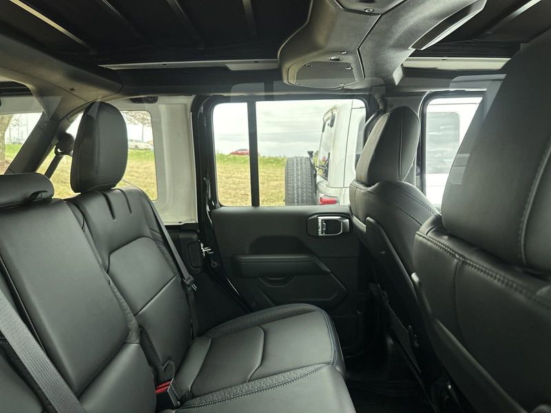2024 Jeep Wrangler 4-door High Altitude 4xe in a Black Clear Coat exterior color and Blackinterior. Gupton Motors Inc 615-384-2886 guptonmotors.com 