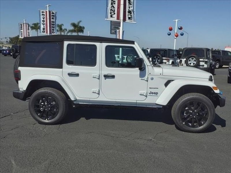 2024 Jeep Wrangler 4-door Sahara 4xe in a Bright White Clear Coat exterior color and Blackinterior. Perris Valley Chrysler Dodge Jeep Ram 951-355-1970 perrisvalleydodgejeepchrysler.com 