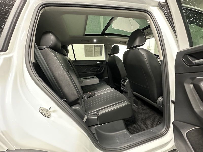 2023 Volkswagen Tiguan SE w/Sunroof & 3rd Row in a Opal White Pearl exterior color and Black Heated Seatsinterior. Schmelz Countryside SAAB (888) 558-1064 stpaulsaab.com 