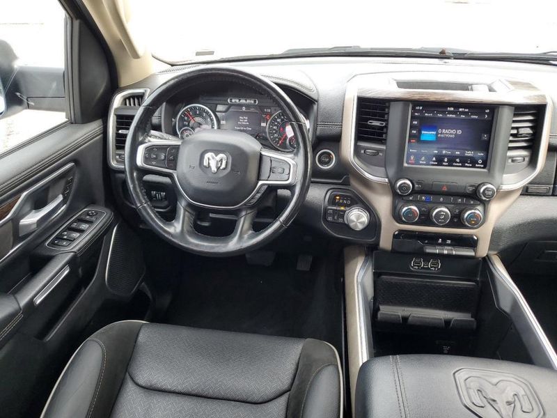 2020 RAM 1500 Laramie in a Bright White Clear Coat exterior color and Blackinterior. Johnson Dodge 601-693-6343 pixelmotiondemo.com 