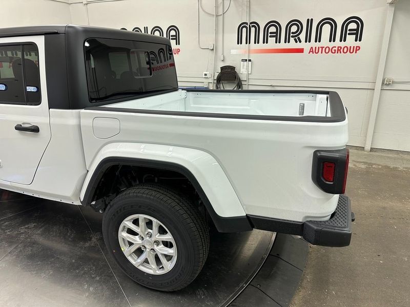 2023 Jeep Gladiator Sport S 4x4 in a Bright White Clear Coat exterior color and Blackinterior. Marina Auto Group (855) 564-8688 marinaautogroup.com 