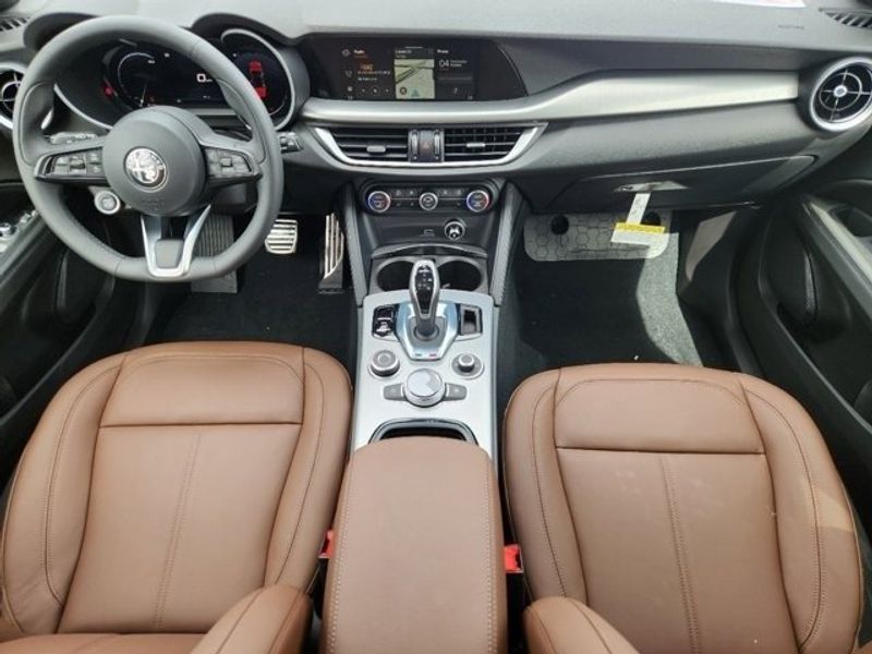 2024 Alfa Romeo Stelvio Ti in a Vesuvio Gray Metallic exterior color and Blackinterior. Northside Imports Houston 281-475-4549 northsideimportshouston.com 