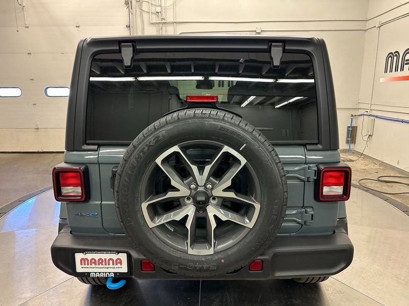 2024 Jeep Wrangler 4-door Sport S 4xe in a Anvil Clear Coat exterior color and Blackinterior. Marina Auto Group (855) 564-8688 marinaautogroup.com 