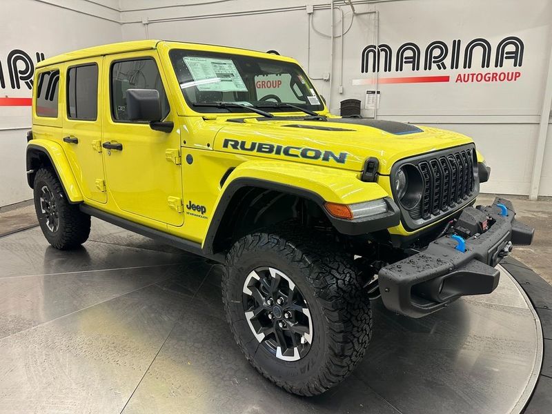 2024 Jeep Wrangler 4-door Rubicon X 4xe in a High Velocity Clear Coat exterior color and Blackinterior. Marina Auto Group (855) 564-8688 marinaautogroup.com 