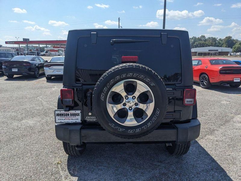 2017 Jeep Wrangler Unlimited Sahara in a Black Clear Coat exterior color and Blackinterior. Johnson Dodge 601-693-6343 pixelmotiondemo.com 