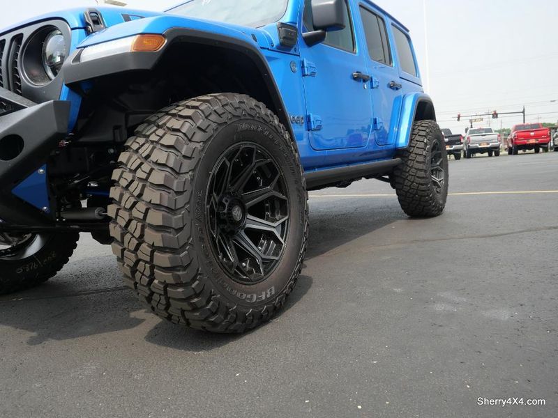 2023 Jeep Wrangler Rubicon 4xe in a Hydro Blue Pearl Coat exterior color and Black/Dark Saddleinterior. Paul Sherry Chrysler Dodge Jeep RAM (937) 749-7061 sherrychrysler.net 