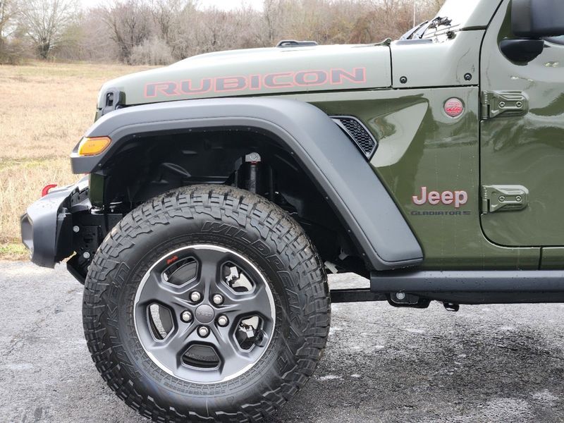 2023 Jeep Gladiator Rubicon 4x4 in a Sarge Green Clear Coat exterior color and Blackinterior. Elder Chrysler Dodge Jeep Ram 9032920419 elderchryslerdodgejeep.com 