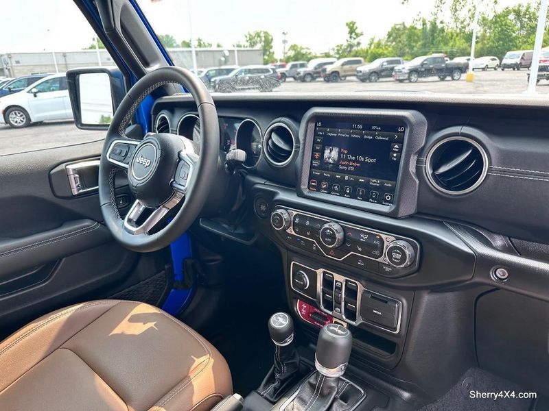 2023 Jeep Wrangler Rubicon 4xe in a Hydro Blue Pearl Coat exterior color and Black/Dark Saddleinterior. Paul Sherry Chrysler Dodge Jeep RAM (937) 749-7061 sherrychrysler.net 