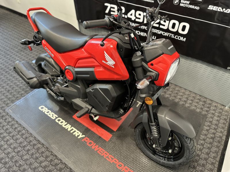 2023 Honda Navi in a RED exterior color. Cross Country Powersports 732-491-2900 crosscountrypowersports.com 