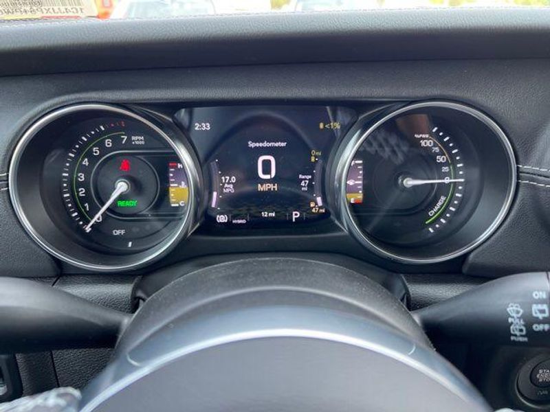 2023 Jeep Wrangler Sahara 4xe in a Silver Zynith Clear Coat exterior color and Blackinterior. Lakeshore CDJR Seaford 302-213-6058 lakeshorecdjr.com 