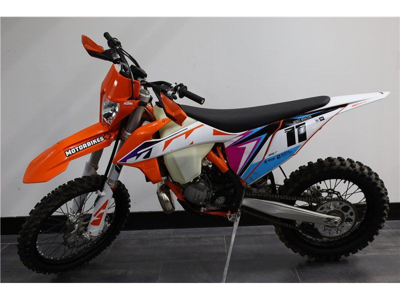 2023 KTM XC 150 W in a Orange exterior color. New England Powersports 978 338-8990 pixelmotiondemo.com 