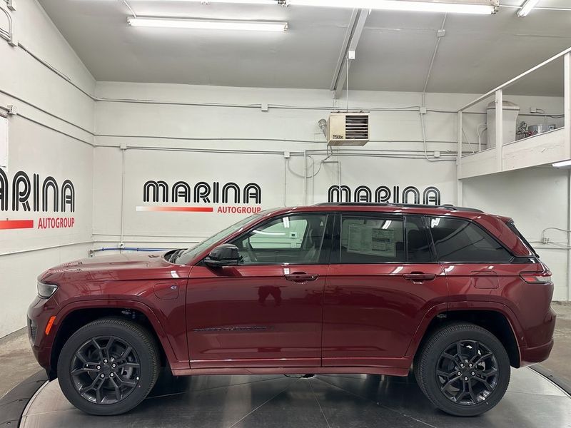 2024 Jeep Grand Cherokee Anniversary Edition 4xe in a Velvet Red Pearl Coat exterior color and Global Blackinterior. Marina Auto Group (855) 564-8688 marinaautogroup.com 