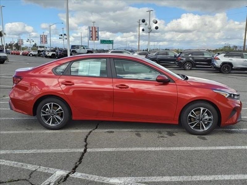 2023 Kia Forte LXS in a Currant Red exterior color and Blackinterior. Perris Valley Auto Center 951-657-6100 perrisvalleyautocenter.com 