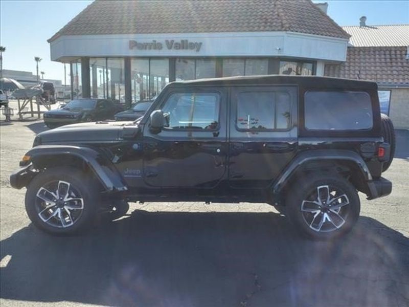 2024 Jeep Wrangler Sport S 4xe in a Black Clear Coat exterior color and Blackinterior. Perris Valley Auto Center 951-657-6100 perrisvalleyautocenter.com 