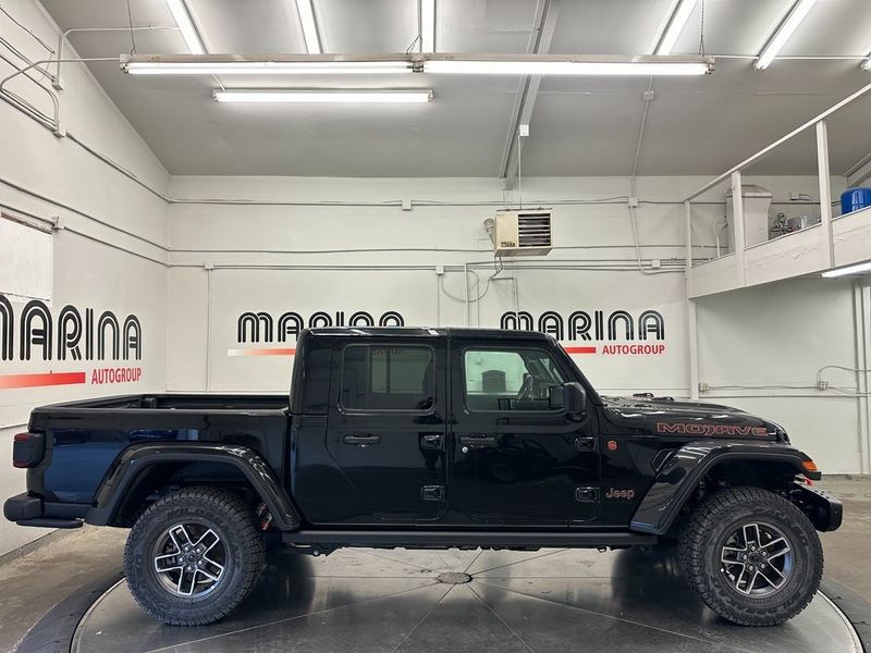 2024 Jeep Gladiator Mojave X 4x4 in a Black Clear Coat exterior color. Marina Chrysler Dodge Jeep RAM (855) 616-8084 marinadodgeny.com 