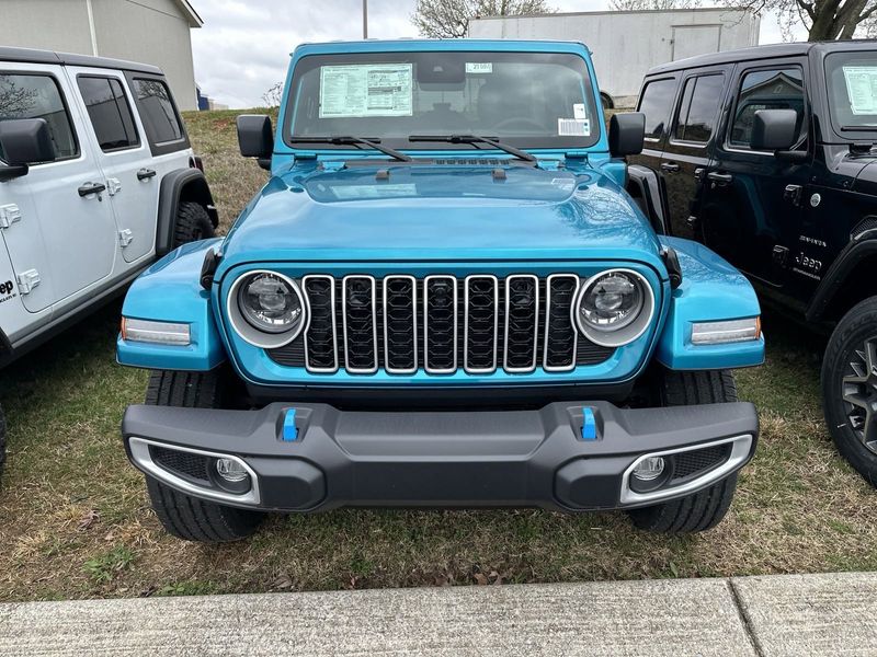 2024 Jeep Wrangler 4-door Sahara 4xe in a Bikini Pearl Coat exterior color. Gupton Motors Inc 615-384-2886 guptonmotors.com 