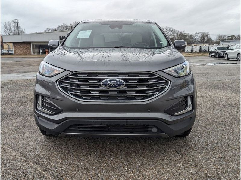 2022 Ford Edge Titanium in a Carbonized Gray Metallic exterior color and Medium Soft Ceramicinterior. Johnson Dodge 601-693-6343 pixelmotiondemo.com 