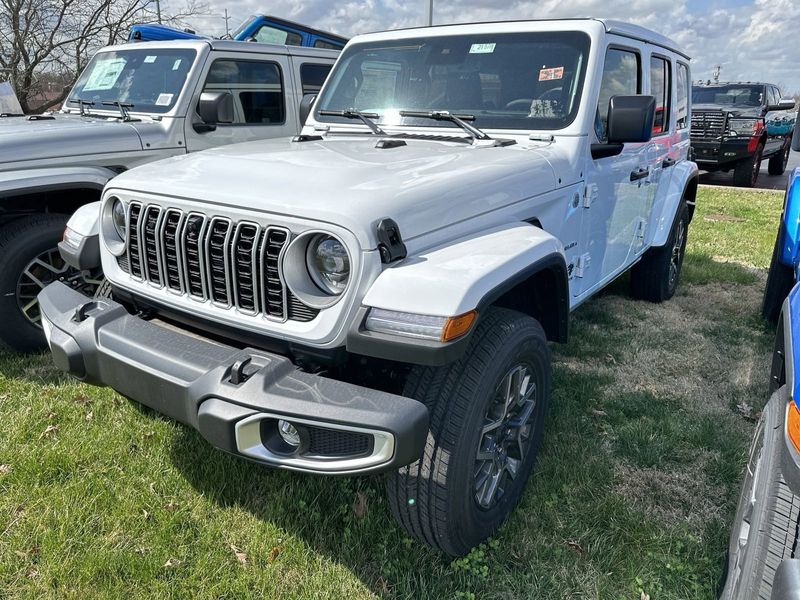 2024 Jeep Wrangler 4-door Sahara in a Bright White Clear Coat exterior color. Gupton Motors Inc 615-384-2886 guptonmotors.com 