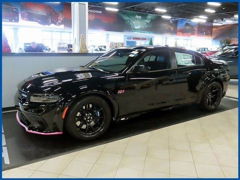 2023 Dodge Charger R/T Scat Pack Widebody in a Pitch Black exterior color and Blackinterior. Papas Jeep Ram In New Britain, CT 860-356-0523 papasjeepram.com 