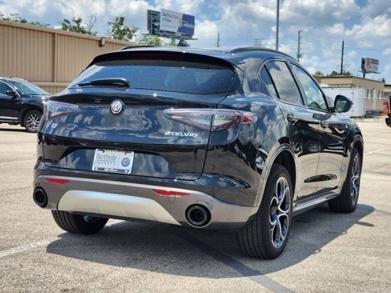 2024 Alfa Romeo Stelvio Ti Awd in a Vulcano Black Metallic exterior color and Chocolateinterior. Northside Alfa Romeo of Houston 281-475-4549 alfaromeousaofnorthhouston.com 