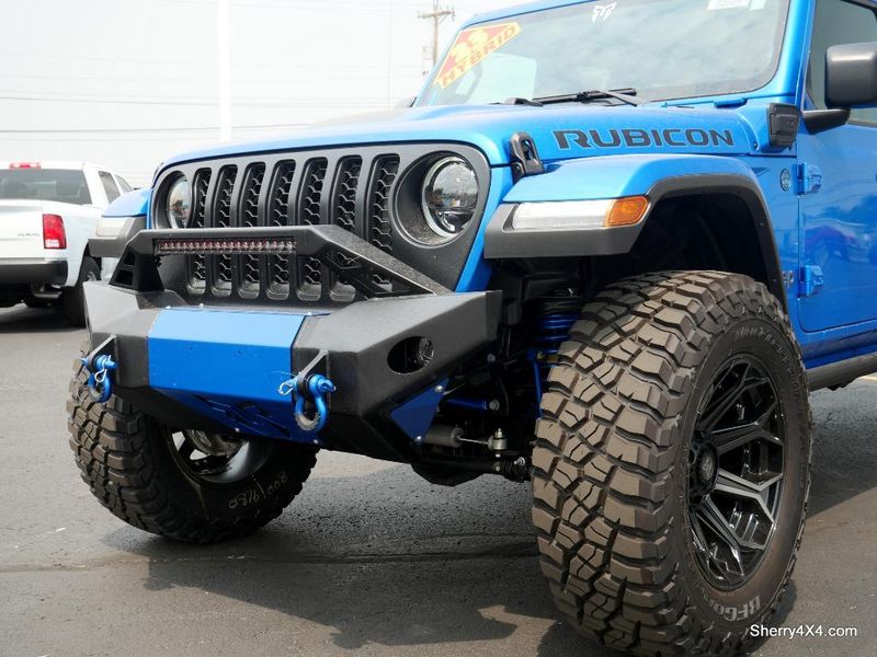 2023 Jeep Wrangler Rubicon 4xe in a Hydro Blue Pearl Coat exterior color and Black/Dark Saddleinterior. Paul Sherry Chrysler Dodge Jeep RAM (937) 749-7061 sherrychrysler.net 