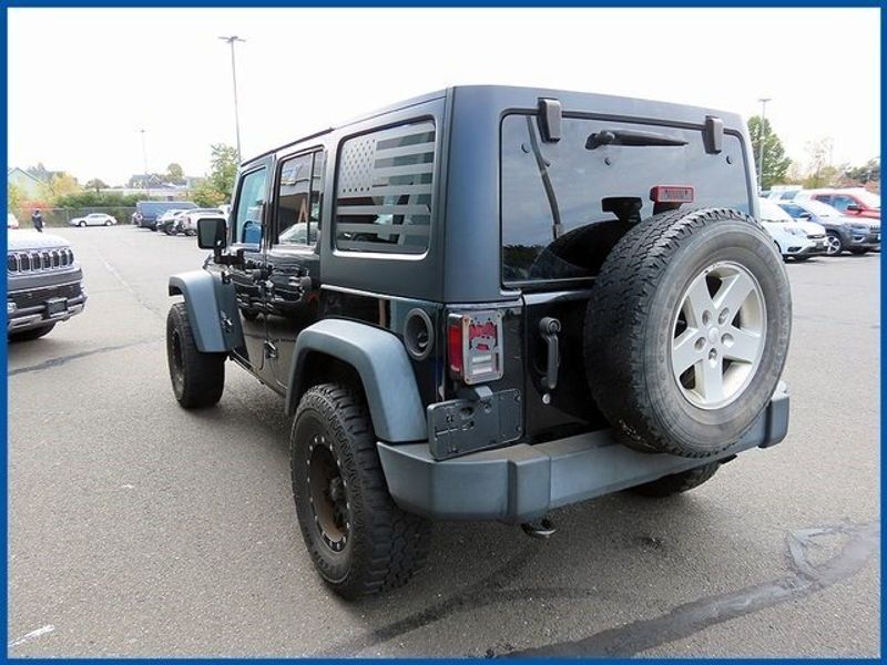 2014 Jeep Wrangler Unlimited Sport in a Black Clear Coat exterior color and Blackinterior. Papas Jeep Ram In New Britain, CT 860-356-0523 papasjeepram.com 