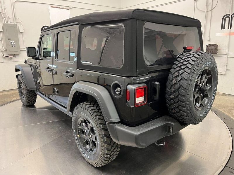 2023 Jeep Wrangler 4-door Willys 4x4 in a Black Clear Coat exterior color and Blackinterior. Marina Chrysler Dodge Jeep RAM (855) 616-8084 marinadodgeny.com 