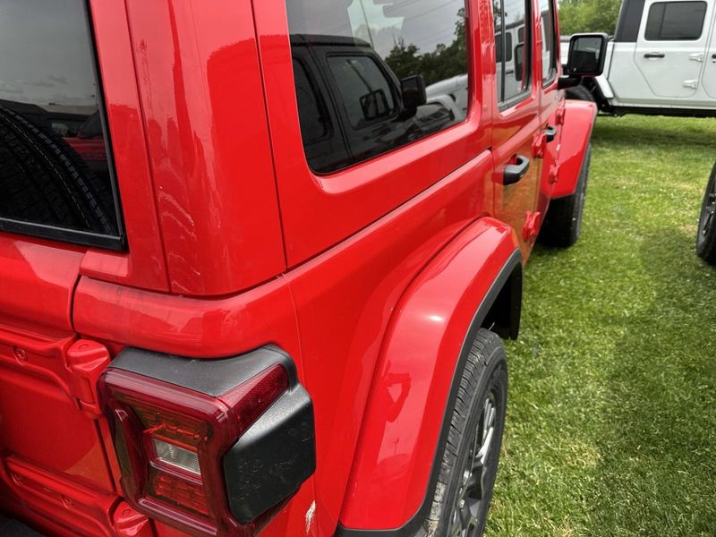 2024 Jeep Wrangler 4-door Sahara in a Firecracker Red Clear Coat exterior color. Gupton Motors Inc 615-384-2886 guptonmotors.com 