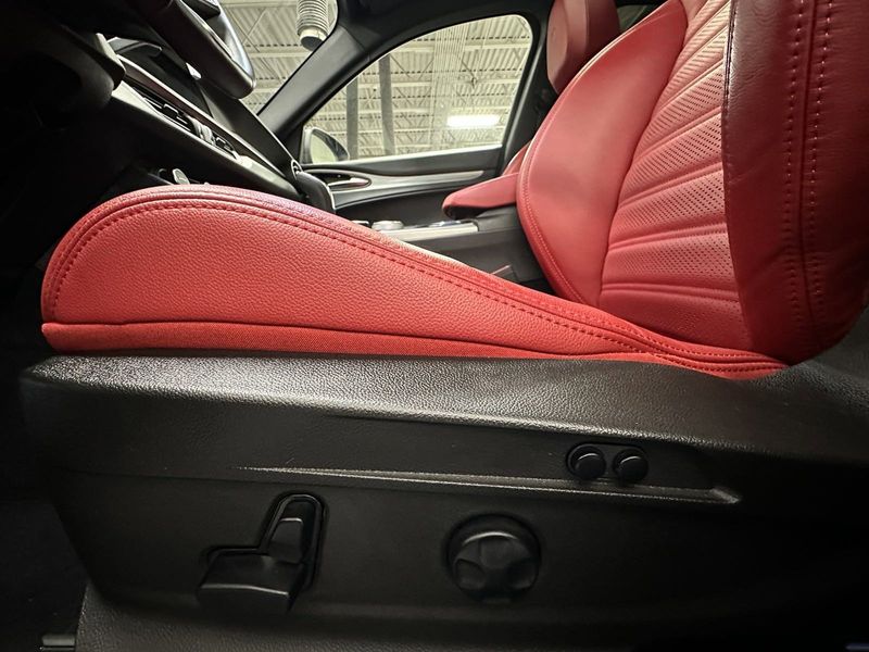 2024 Alfa Romeo Stelvio Veloce AWD w/Sunroof & Navi in a Vesuvio Gray Metallic exterior color and Red Sport Heated Leatherinterior. Schmelz Countryside SAAB (888) 558-1064 stpaulsaab.com 
