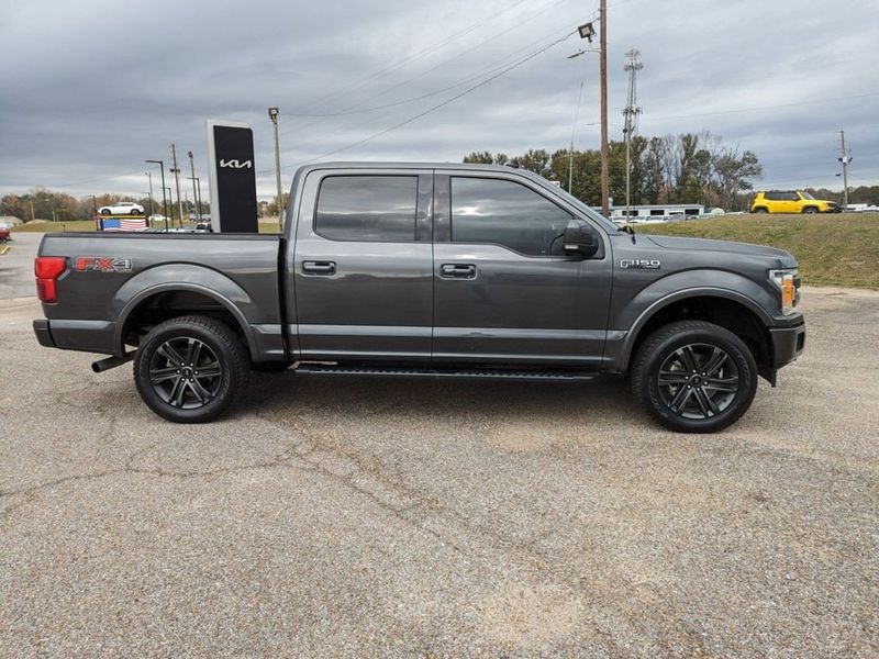 2020 Ford F-150 Lariat in a Magnetic Metallic exterior color and Blackinterior. Johnson Dodge 601-693-6343 pixelmotiondemo.com 