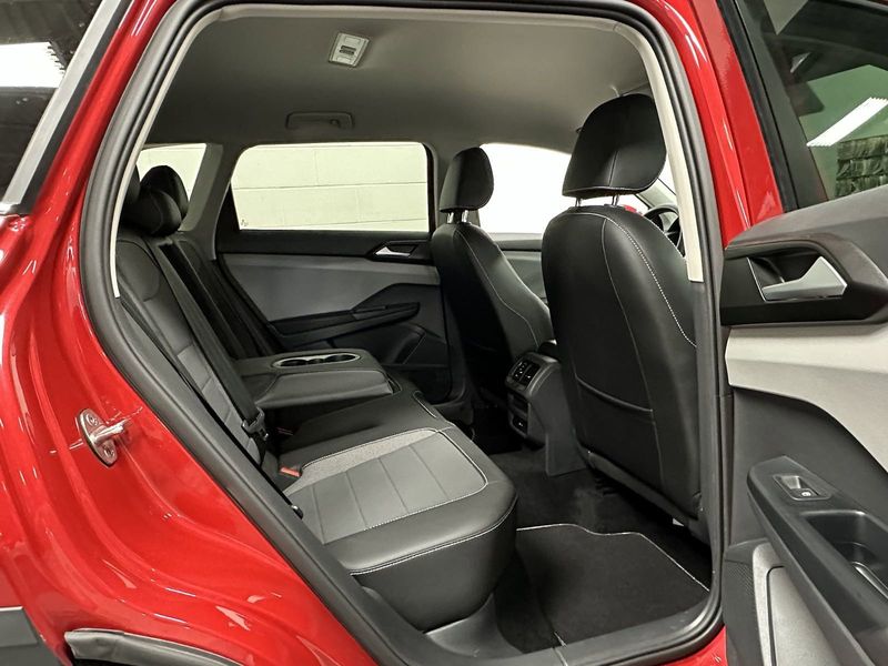 2023 Volkswagen Taos SE 4-Motion AWD w/Black Wheel Pkg in a Kings Red Metallic exterior color and Black heated seatsinterior. Schmelz Countryside Alfa Romeo (651) 867-3222 schmelzalfaromeo.com 