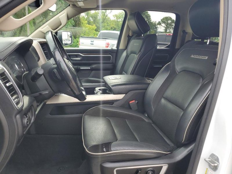 2020 RAM 1500 Laramie in a Bright White Clear Coat exterior color and Blackinterior. Johnson Dodge 601-693-6343 pixelmotiondemo.com 