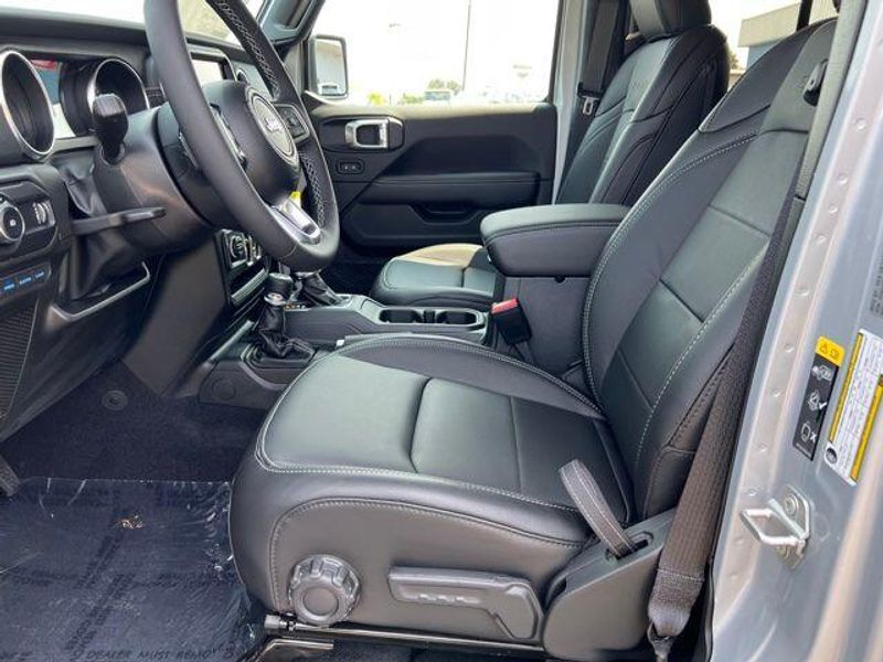 2023 Jeep Wrangler Sahara 4xe in a Silver Zynith Clear Coat exterior color and Blackinterior. Lakeshore CDJR Seaford 302-213-6058 lakeshorecdjr.com 