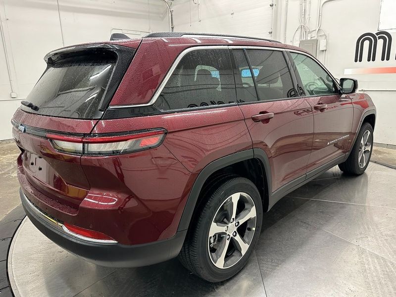 2024 Jeep Grand Cherokee 4xe in a Velvet Red Pearl Coat exterior color and Wicker Beige/Global Blackinterior. Marina Auto Group (855) 564-8688 marinaautogroup.com 