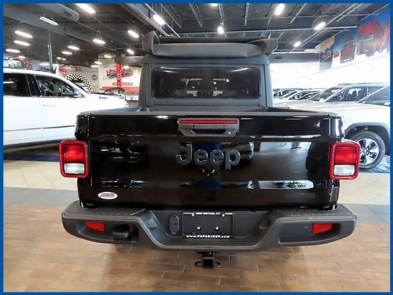 2021 Jeep Gladiator Sport in a Black Clear Coat exterior color and Blackinterior. Papas Jeep Ram In New Britain, CT 860-356-0523 papasjeepram.com 