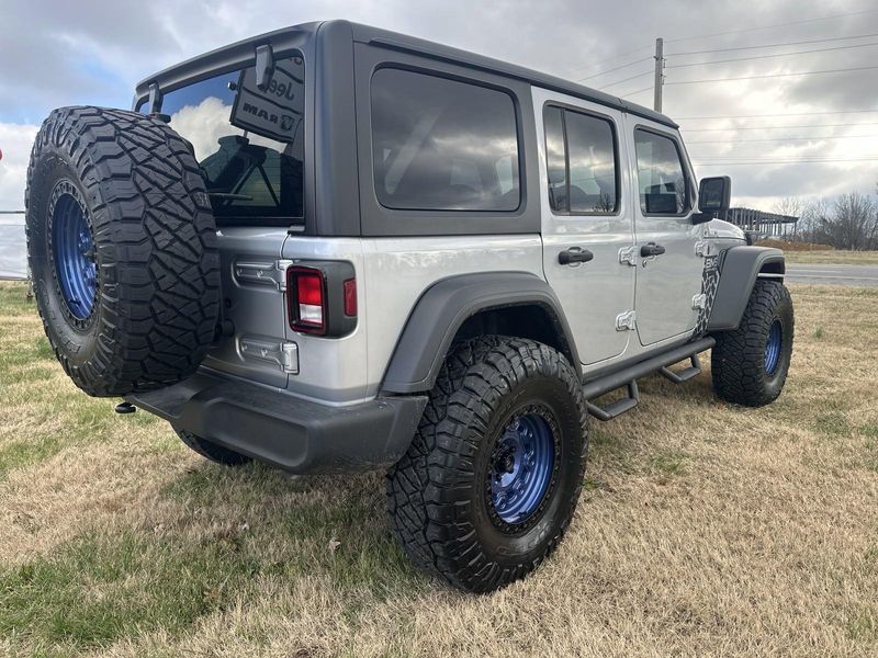 2024 Jeep Wrangler 4-door Sport S in a Silver Zynith Clear Coat exterior color and Blackinterior. Gupton Motors Inc 615-384-2886 guptonmotors.com 