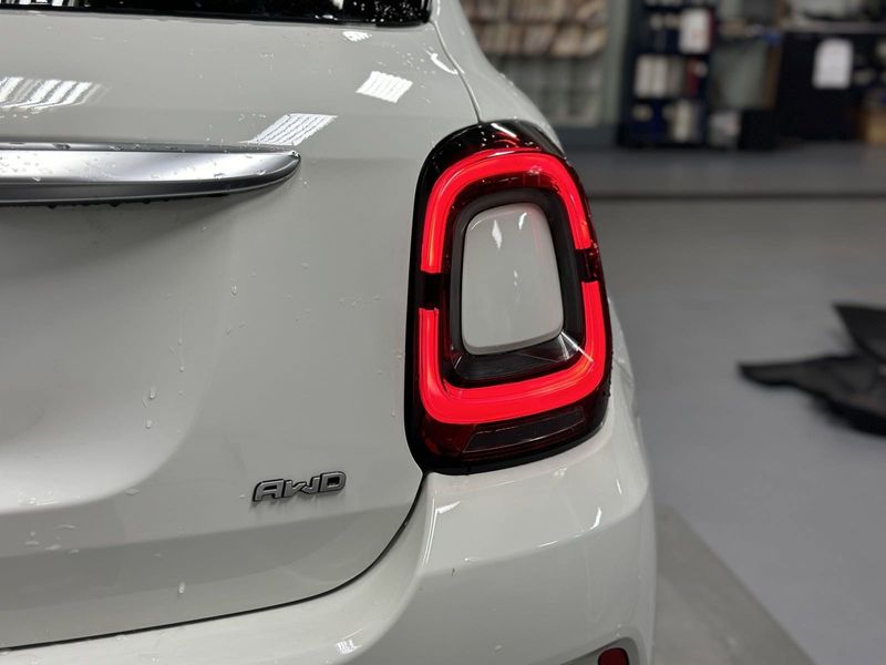 2023 Fiat 500x Pop Awd in a Bianco Gelato (White Clear Coat) exterior color and Blackinterior. Schmelz Countryside Alfa Romeo and Fiat (651) 968-0556 schmelzfiat.com 