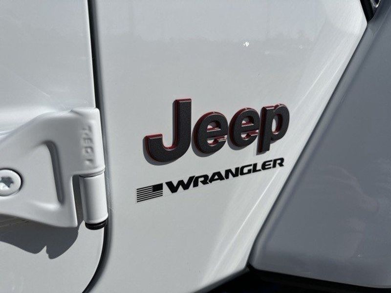 2024 Jeep Wrangler Rubicon in a Bright White Clear Coat exterior color and Blackinterior. Randall Dodge Chrysler Jeep 877-790-6380 randalldodgechryslerjeep.com 