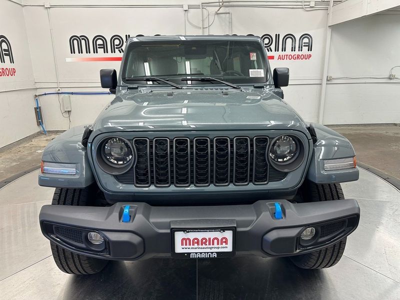 2024 Jeep Wrangler 4-door Sport S 4xe in a Anvil Clear Coat exterior color and Blackinterior. Marina Auto Group (855) 564-8688 marinaautogroup.com 