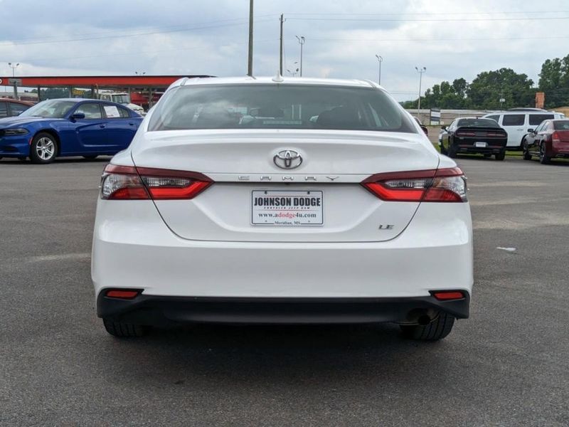 2022 Toyota Camry LE in a WHITE exterior color. Johnson Dodge 601-693-6343 pixelmotiondemo.com 