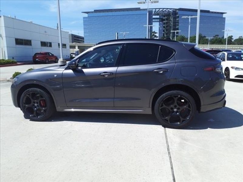 2024 Alfa Romeo Stelvio Ti in a Vesuvio Gray Metallic exterior color and Blackinterior. Northside Imports Houston 281-475-4549 northsideimportshouston.com 