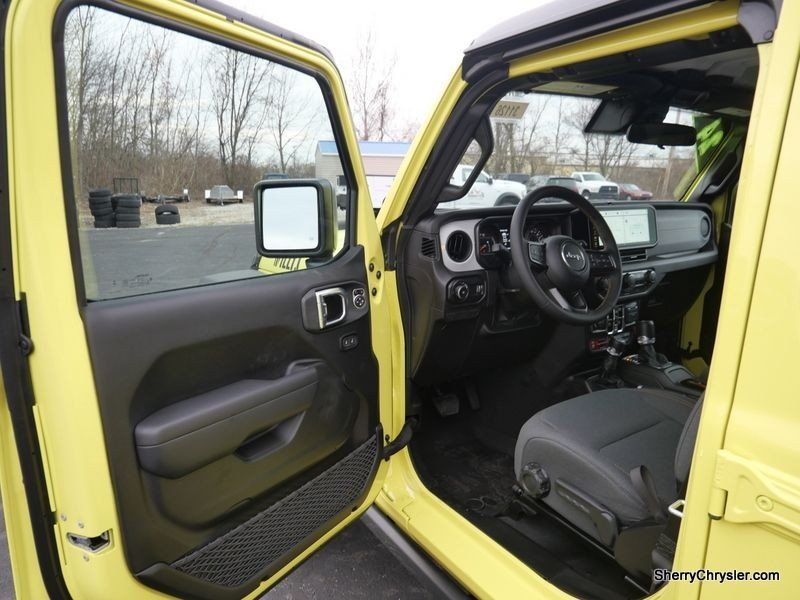 2024 Jeep Wrangler 4-door Willys in a High Velocity Clear Coat exterior color and Blackinterior. Paul Sherry Chrysler Dodge Jeep RAM (937) 749-7061 sherrychrysler.net 